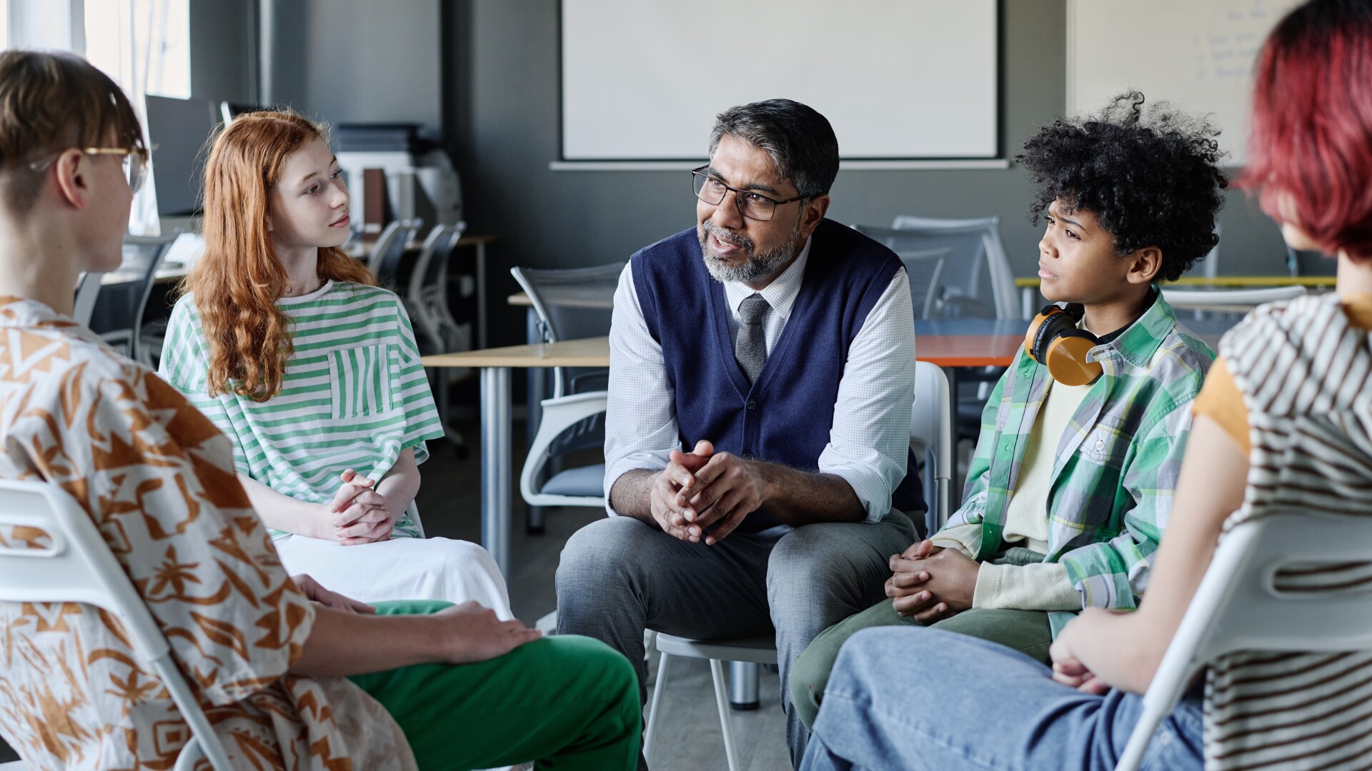 Youths gathered in group therapy session